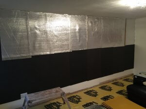 sound barrier layer and barrier mat layer applied to wall